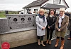 Sisters Cathy Michale, Colleen McKenna and Eileen Reavey unveil the monument commemorating their  brothers, John Martin, Brian and Anthony.