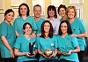 Practice Partners Katrina McKevitt and Doctor Conor McEnhill with the staff of Apple Tree Dental Care, Newry.