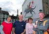 Theresa Hince, Garry McElherron, Iúr Cinn Fleadh; Nina West and artist Kev Largey/ KVLR with the  new fleadh mural at Kilmorey Street in Newry, a tribute to the late artist John Farrelly. Photograph: Columba O'Hare/ Newry.ie 