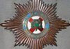 The star of the Order with an enamel centrepiece decorated with a shamrock and crowns, the Cross of St. Patrick, the motto and the date of creation of the Order. (Newry and Mourne Museum Collection).