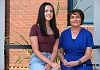  Chloe Coughlan is congratulated by Mrs McAlinden on achieving an exceptional 10 A* grades.
