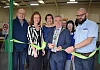 Cllr Mark Murnin, Chair, Newry, Mourne and Down District Counci cuts the tape to open the Habitat ReStore in Newry.