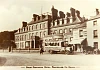The Great Northern Hotel pictured in the early 20th century with a local touring bus in the foreground. The Woodside Restaurant can also be seen adjacent to the hotel. Newry and Mourne Museum Collection.
