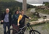 Mayor of Kirovsk, Vladimir Diadik and his wife Natalia at Kilbroney Park along with UK Downhill Cycling Champion Chris Cumming.
