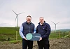 3T Power Sales Manager John-Francis Collins and Julian Coldrick, Director of Sustainability, Hub Packaging, at 3T Power’s Belfast-based wind farm.