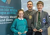 Cllr Phillip Campbell presents the awards to the winners, Charlotte Magee from St Malachy’s Primary School, Camlough and Conor Rooney-Davis, from Kilkeel’s St Louis Grammar School.