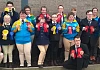 Members of Saddle & Reins Special Olympics Equestrian Club with their rosettes.