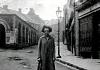 Black and White photograph taken outside the Butter Market, Middle market Square, Newry. This market was erected in the 19th Century in the same locale (bottom of High Street) as the old Market House mentioned in the article. Newry and Mourne Museum Collection