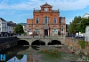 Wreaths strewn all along the mud banks of the Clanrye River after being removed from the Cenotaph outside Newry Town Hall. Photograph: Columba O'Hare/ Newry.ie 