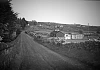 Black and white photo of houses and stone walls on the Head Road near the entrance to the Silent Valley in the Mourne Mountains, circa 1960s. This is the area associated with the Bingian Light Story. Newry & Mourne Museum Collection