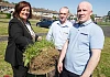 Chairperson of Newry, Mourne & Down District Council, Gillian Fitzpatrick  cuts the first sod  under the eye of  Drumalane Quayside Close Community Association Chairman, Gerard Hutchinson  and Secretary, Gerry Coye.