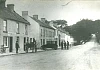 Photograph of Newry Road, Hilltown. Lowry’s taxi can be seen in the image.  Newry and Mourne Museum Collection