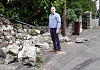 Cllr Mickey Larkin looks at the damage done when a lorry crashed into a wall in Jonesborough.