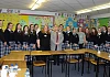 Alliance party leader Naomi Long with party members Helena Young and Jackie Coade pictured with students at Our Lady's Grammar School.