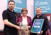 Conall Burns and Ciaran Brannigan from Bayview Contracts received the award for Planned Maintenance Services from Housing Executive Chair, Nicole Lappin