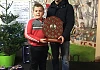 Ryan Mc Aleavey winner of the ‘Richard Hughes Shield’ receives his trophy from Kevin Hughes 