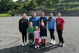 Joanne Patterson and Cllr David Taylor with some sporting youngsters at Newry High School.