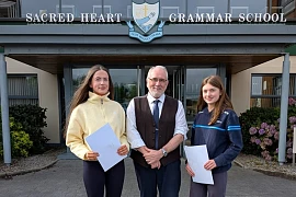 Sacred Heart Principal, Shane Comer, with Ellen Webster and Sinead O’Neill who got their GCSE results at Sacred Heart Grammar School.