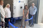 Infrastructure Minister Kimmins cuts the ribbon of the Thermal Vacuum (TVAC) with Robert Hill, Director of the NI Space Office and NI Space Cluster Manager, Donna Mallon Director at Resonate Testing and Tom Mallon, Resonate Managing Director: Caption 2 Infrastructure Minister Liz Kimmins is welcomed to Resonate Testing by their Managing Director Tom Mallon as the company launch their new Thermal Vacuum capability 