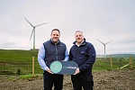 3T Power Sales Manager John-Francis Collins and Julian Coldrick, Director of Sustainability, Hub Packaging, at 3T Power’s Belfast-based wind farm.