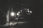 Photograph of Bridge Street, Newry, lit by gaslight. Newry and Mourne Museum Collection