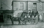 Photograph of a Norton & Co. “Long Car” outside the Courthouse in Kilkeel, c.1887. The open-air service operated along the coastal route between the business’ hotels in Newcastle and Rostrevor. Newry & Mourne Museum, Irvine Collection