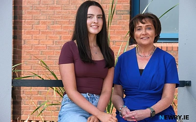  Chloe Coughlan is congratulated by Mrs McAlinden on achieving an exceptional 10 A* grades.