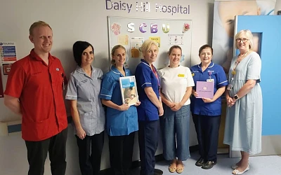 Head of Service for Paediatrics Bernie McGibbon, right and Ward Manager Jacob Moran Durham are pictured with the team in the Special Care Baby Unit (SCBU) in Daisy Hill Hospital.