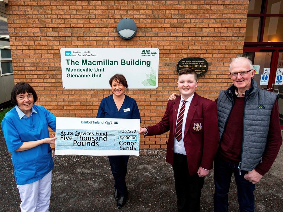 Conor Sands, his father Niall Sands, present their Cheque for £5000 to Dr Boyd consultant haematologist (centre)  and Louise haematology advanced nurse practitioner 